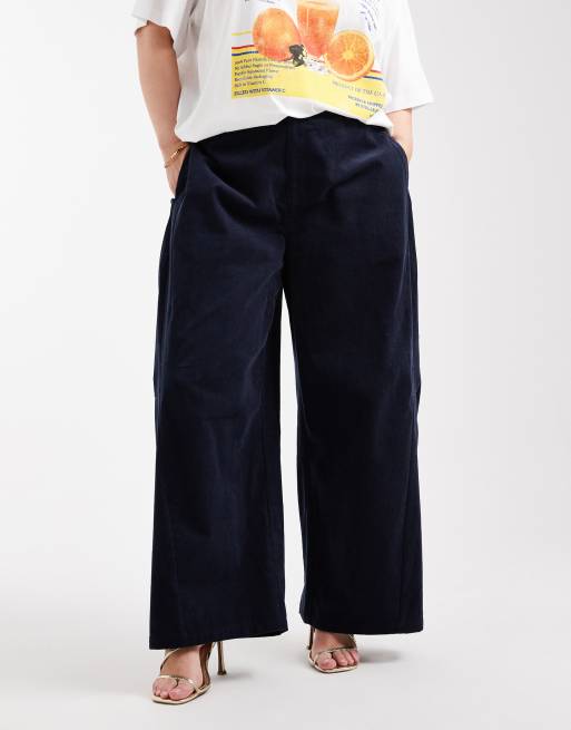 ASOS DESIGN Curve baby cord extreme horseshoe pants with seam detail in navy