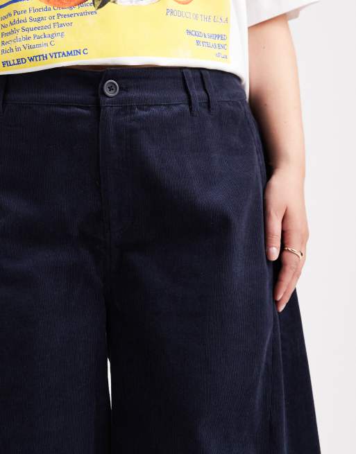 ASOS DESIGN Curve baby cord extreme horseshoe pants with seam detail in navy