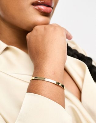 ASOS DESIGN Curve bangle bracelet in minimal design in gold tone