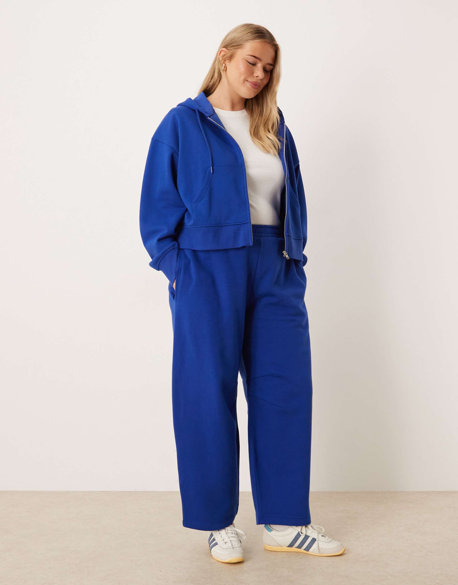 asos design curve barrel leg brushback sweatpants in deep blue