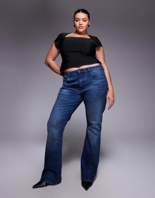 ASOS DESIGN Curve - Bootcut-Jeans in dunkler mittlerer Waschung-Blau
