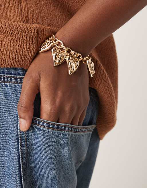 ASOS DESIGN Curve - Bracciale dorato con charm a cuore e chiusura con barretta