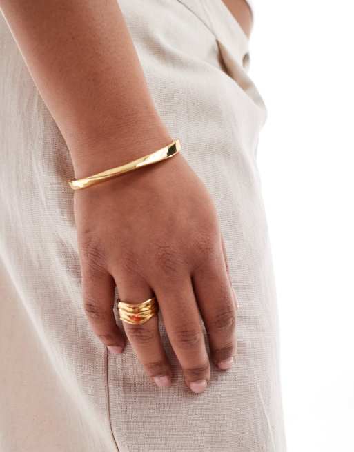 ASOS DESIGN Curve - Bracciale rigido con design minimal attorcigliato placcato oro 14 kt