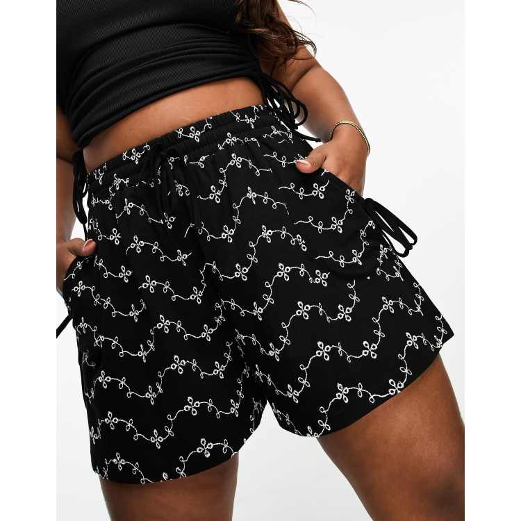 ASOS DESIGN Curve broderie shorts with tie pockets in black/white