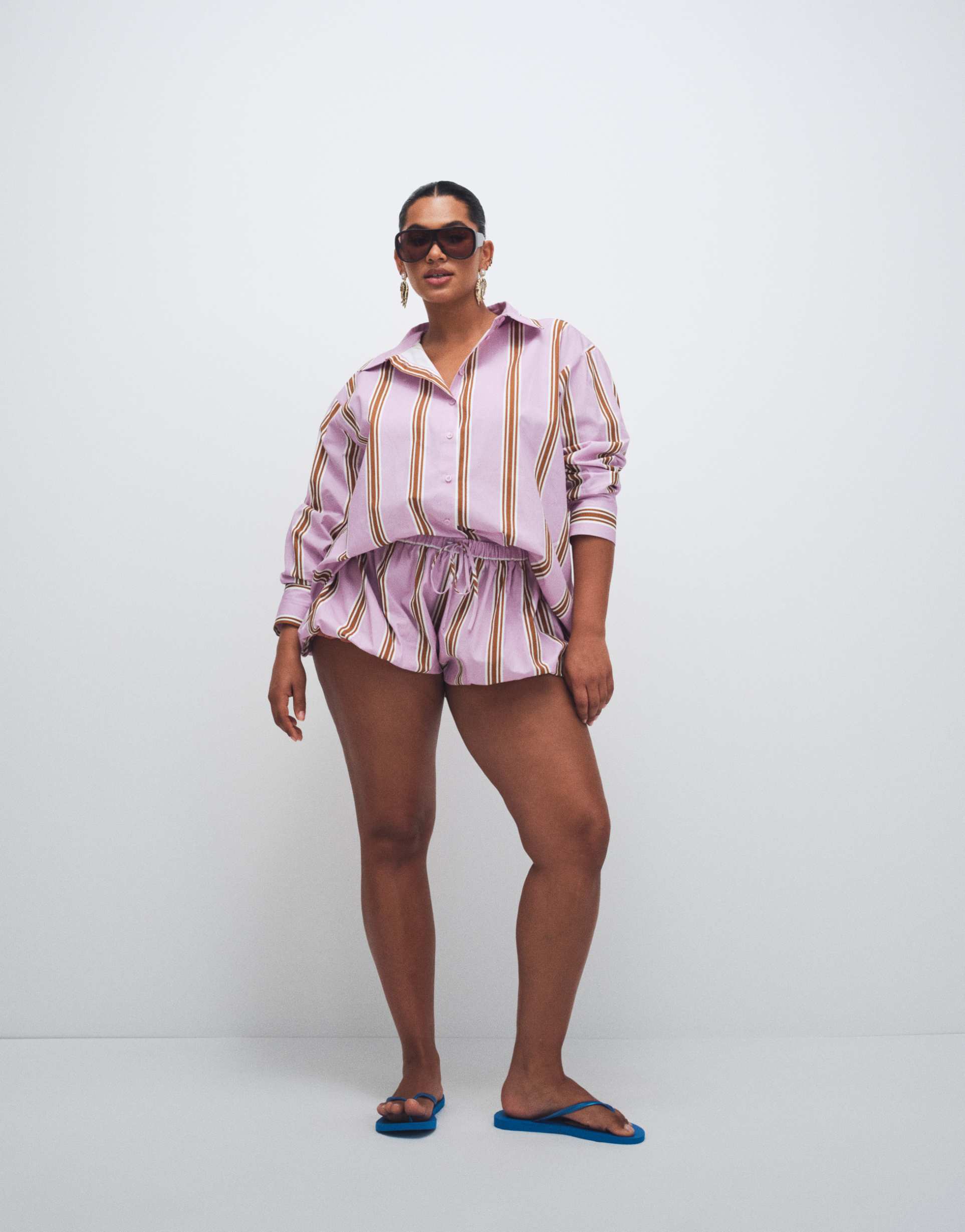 asos design curve bubble hem shorts in lilac striped print