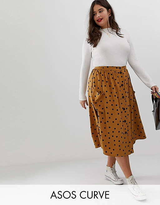 ASOS DESIGN Curve button front midi skirt in polka dot with oversized pockets