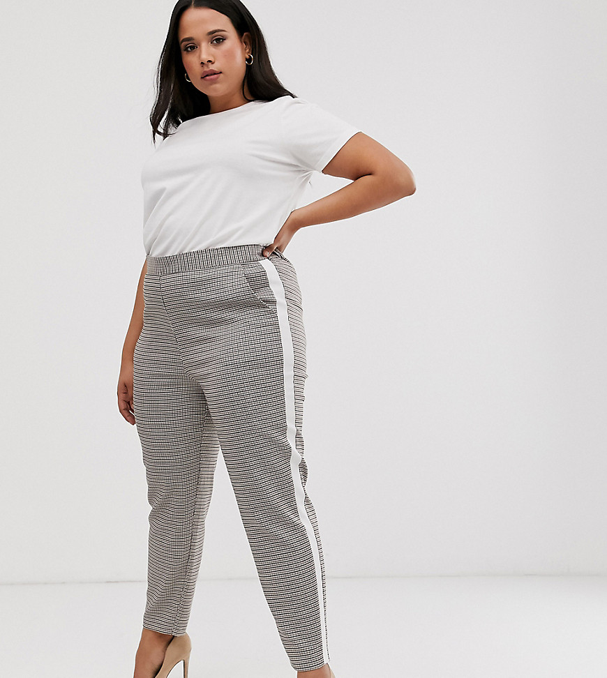 Plus-size trousers by ASOS DESIGN They’re everything you’ve been scrolling for High rise Stretch-back waist Check design Side-stripe taping Regular, tapered fit A standard cut around the thigh with a narrow shape through the leg