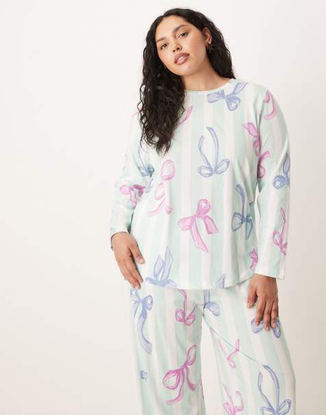 ASOS DESIGN Curve Christmas bow long sleeve top & pants pajama set in blue stripe - view 1