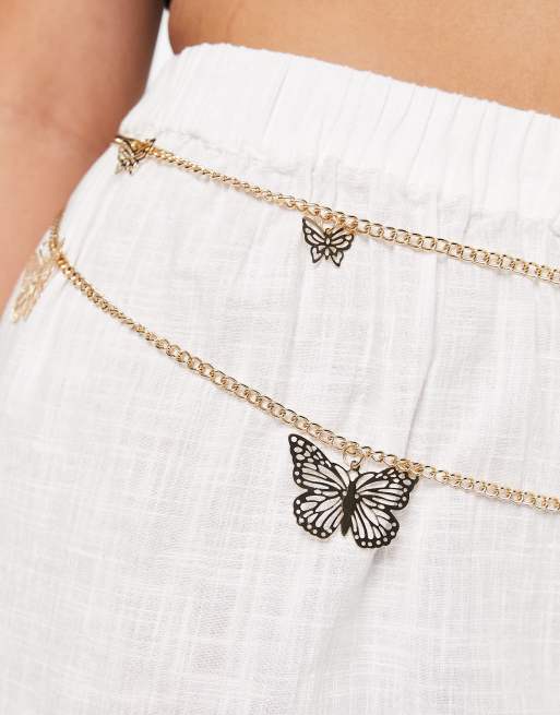 ASOS DESIGN Curve - Cintura a catena color oro con farfalla