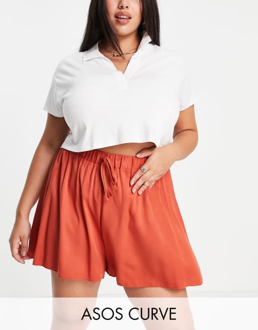 ASOS DESIGN Curve co-ord drawstring high waisted  flippy shorts in rust