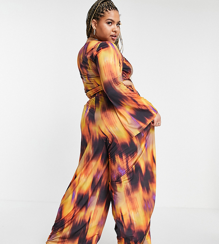 Plus-size trousers by ASOS DESIGN Part of a co-ord set Top sold separately All-over flame print High rise Elasticated waist Wide leg Regular fit
