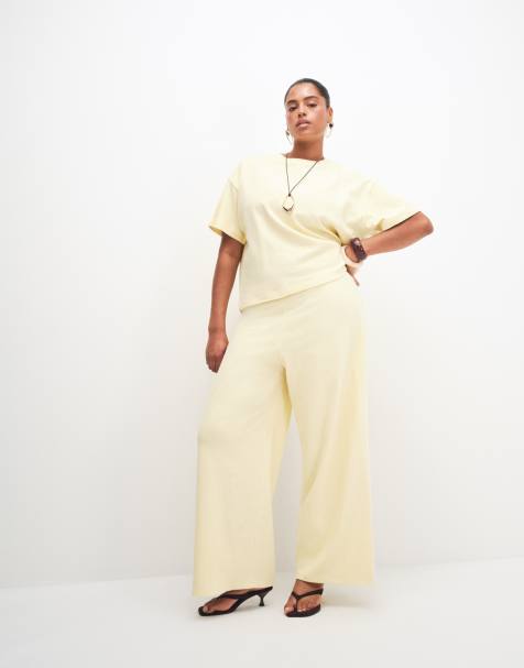 ASOS DESIGN Curve - Co-ord set van oversized T-shirt en broek met wijde pijpen en textuur in lichtgeel - view 1