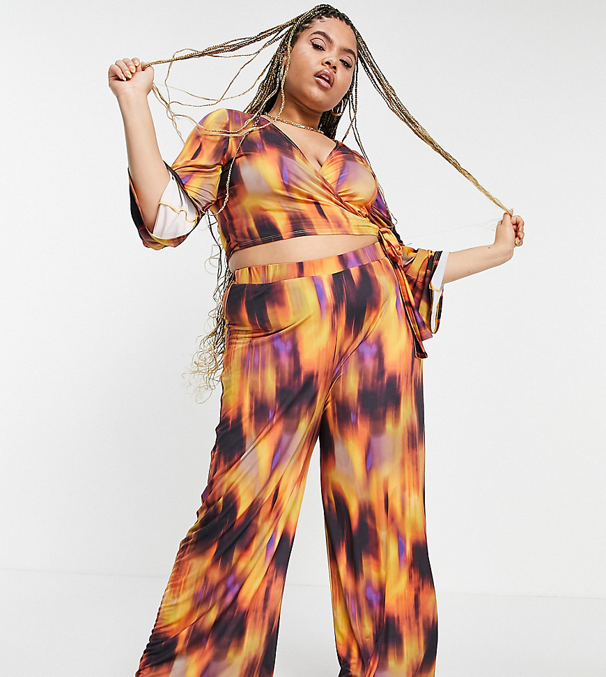 Plus-size top by ASOS DESIGN Part of a co-ord set All-over flame print Wrap front Fluted sleeves Tie hem Cropped length Slim fit