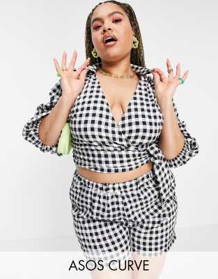 Plus-size top by ASOS DESIGN Part of a co-ord set Shorts sold separately Wrap front Puff sleeves Cropped length Regular fit