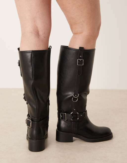 ASOS DESIGN Curve Cobra buckle harness knee boots with silver hardware in black