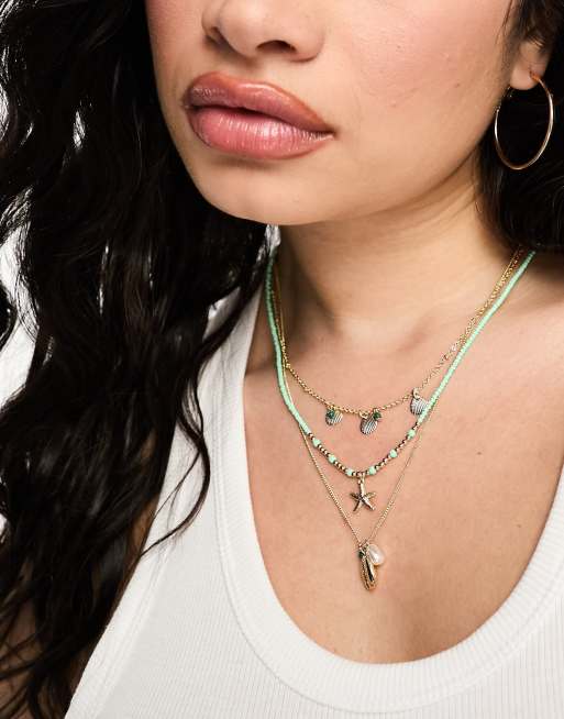 ASOS DESIGN Curve - Collana multifilo color oro con conchiglie e perline miste