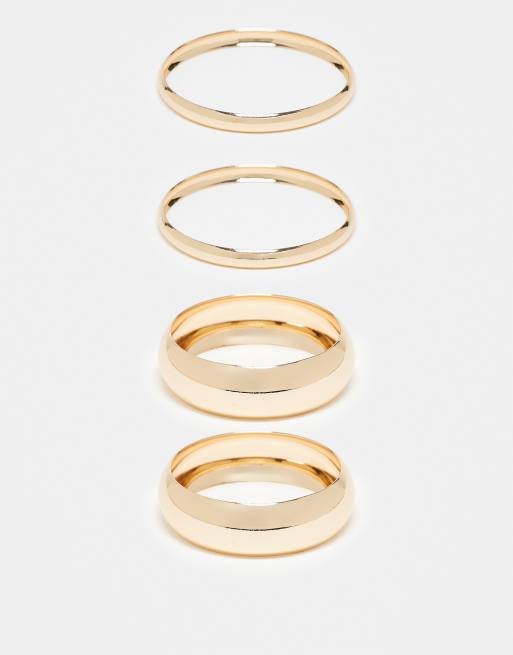 ASOS DESIGN Curve - Confezione da 4 bracciali rigidi lucidi color oro