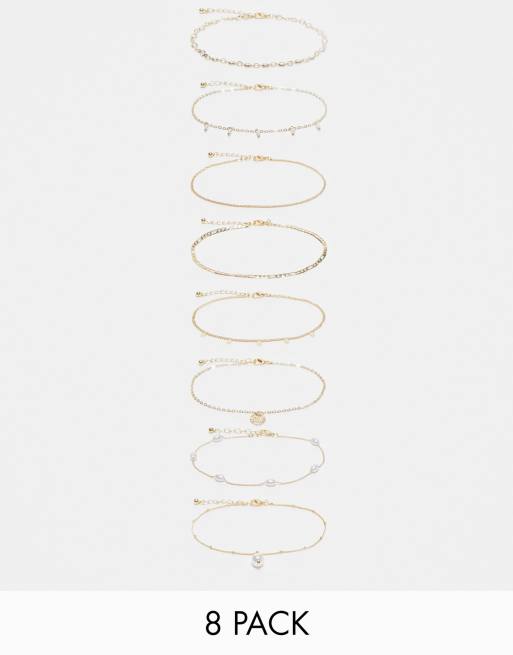 ASOS DESIGN Curve - Confezione da 8 cavigliere a catenina miste dorate con perle sintetiche