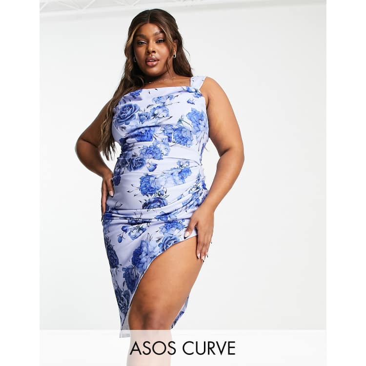 Plus Size Female Model Posing in Blue Dress on White Background