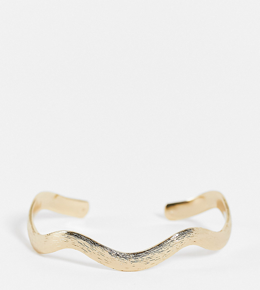 ASOS DESIGN Curve cuff bracelet in wave design in gold tone