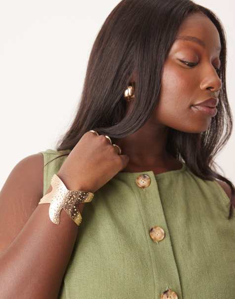 ASOS DESIGN Curve cuff bracelet with starfish detail in gold tone - view 1