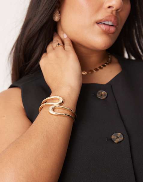 ASOS DESIGN Curve cuff bracelet with wraparound open design in gold tone - view 1
