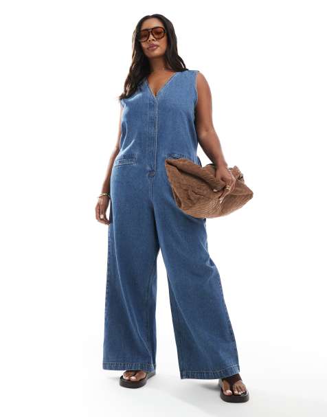 ASOS DESIGN Curve denim sleeveless loose jumpsuit in midwash blue - view 1