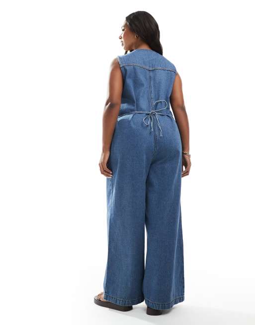 ASOS DESIGN Curve denim sleeveless loose jumpsuit in midwash blue