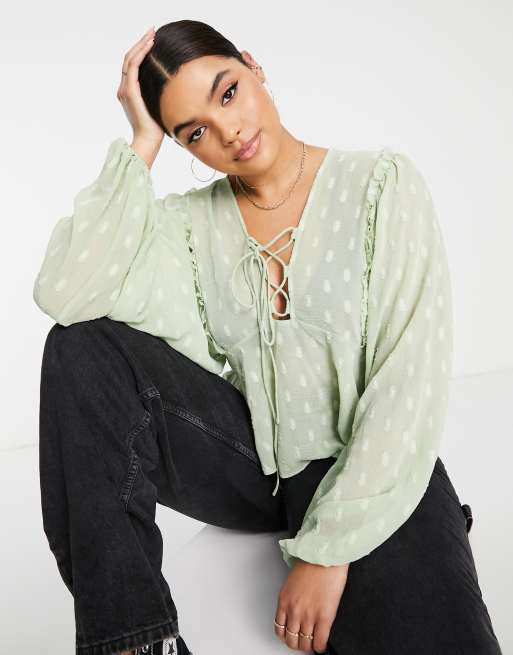 ASOS DESIGN Curve dobby long sleeve blouse with lace up front & peplum hem in sage, 2 of 4