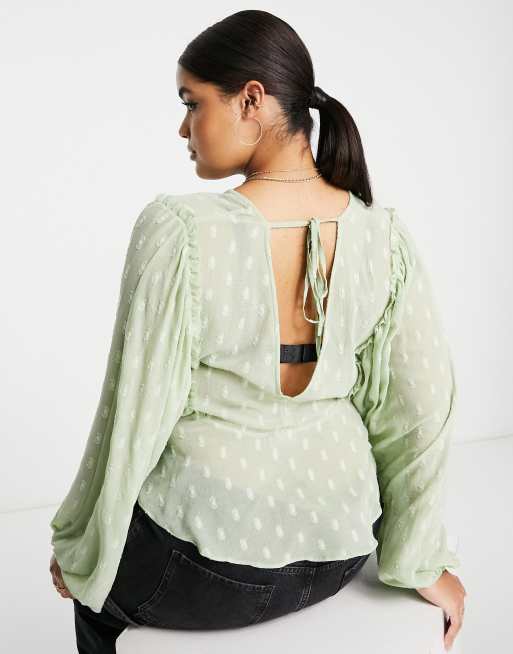 ASOS DESIGN Curve dobby long sleeve blouse with lace up front & peplum hem in sage, 3 of 4