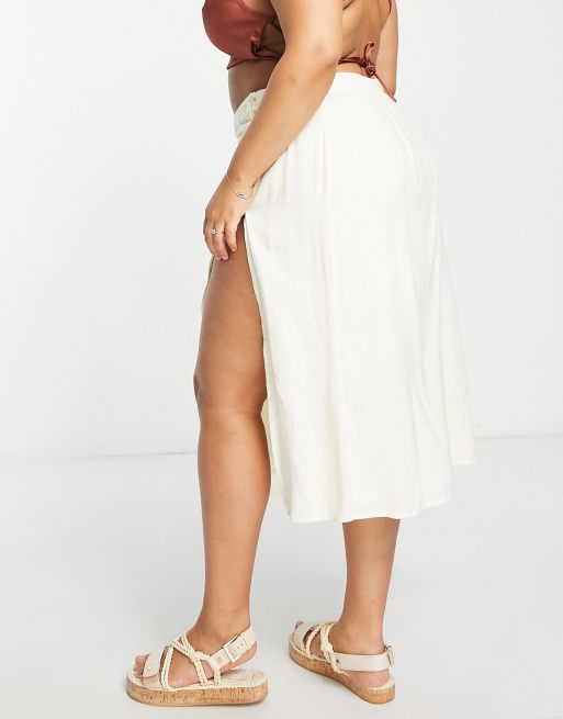 ASOS DESIGN Curve drapey button side thigh split midi skirt in cream