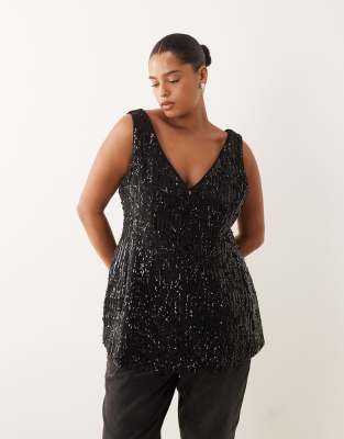 ASOS DESIGN Curve - Elegantes, tailliertes Schößchenoberteil in Schwarz mit V-Ausschnitt und Paillettenbesatz