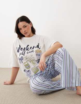 ASOS DESIGN Curve - Ensemble de pyjama avec pantalon ample et t-shirt oversize à inscription Weekend Self Care »-Bleu L