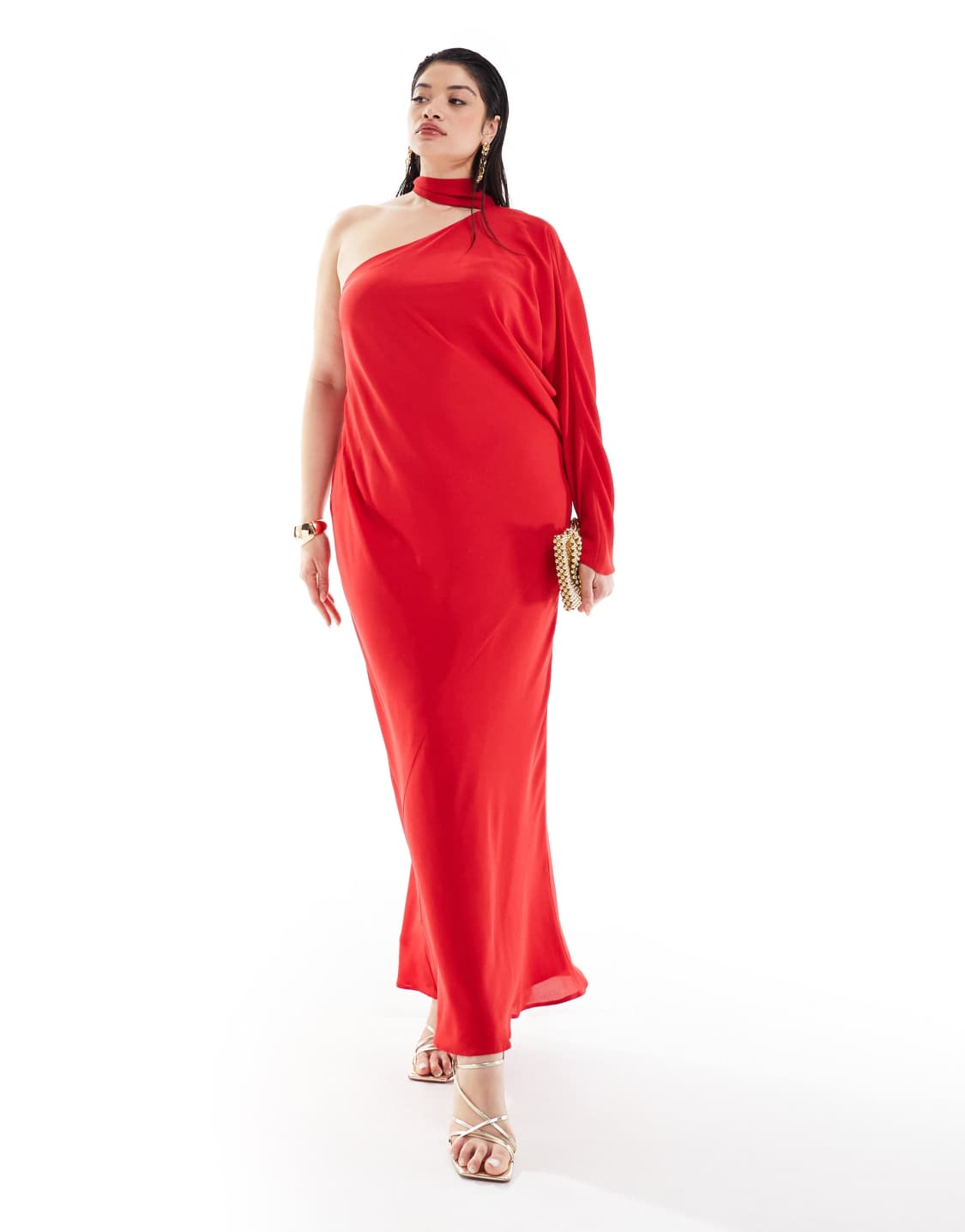 A plus-size, one-sleeve red maxi dress with a built-in neck scarf