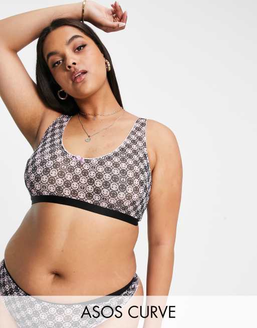 ASOS DESIGN Curve – Exklusiver Netzstoff-BH in Rosa und Schwarz mit Smiley-Muster