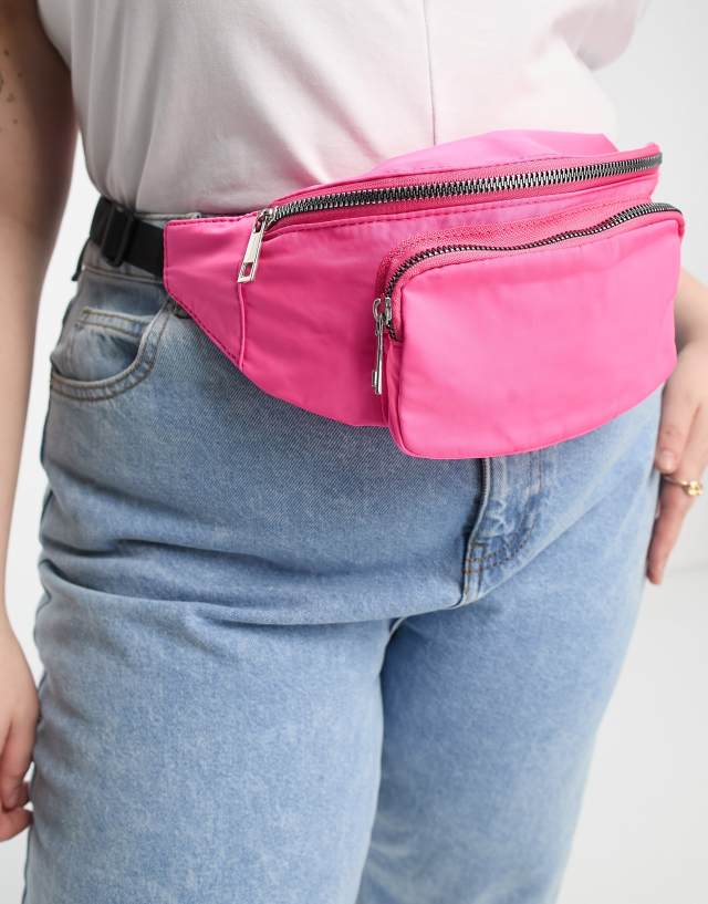 ASOS DESIGN Curve fanny pack with front pocket in pink