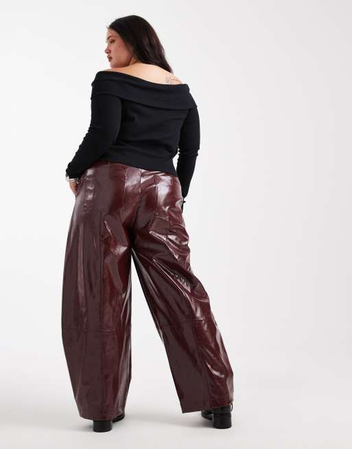 ASOS DESIGN Curve faux leather barrel leg pants with tab detail in burgundy