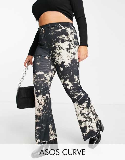 ASOS DESIGN Curve flare trouser in cutabout tie dye print with raw edge exposed seams