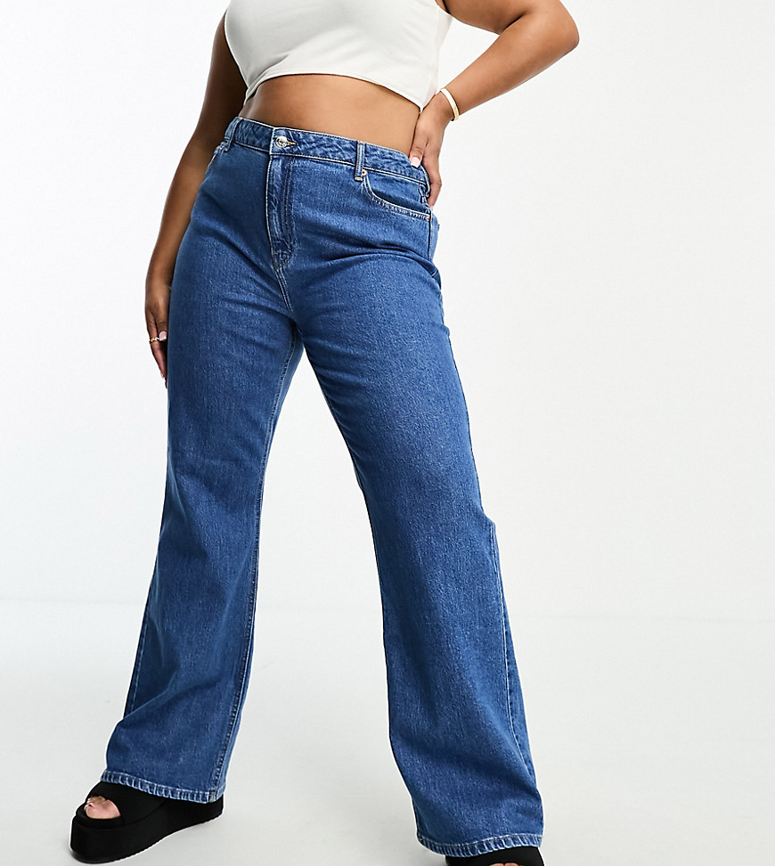 ASOS DESIGN Curve flared jeans in mid blue