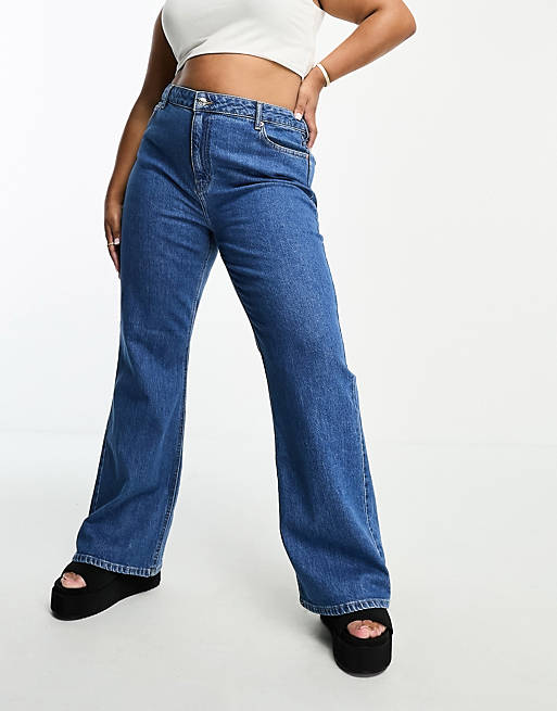 ASOS DESIGN Curve flared jeans in mid blue | ASOS