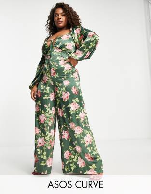 ASOS DESIGN Curve - Freizeit-Jumpsuit aus Satin mit Schnürung am Rücken und Blumenmuster-Bunt