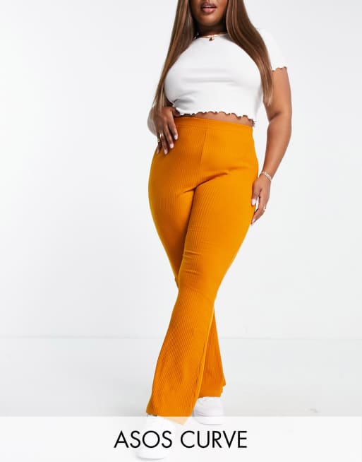 ASOS DESIGN Curve – Gerippte Schlaghose in Senfgelb