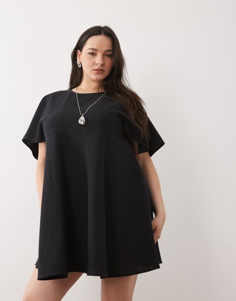 ASOS DESIGN Curve – Gesmoktes, kurzes T-Shirt-Kleid in Schwarz - view 1