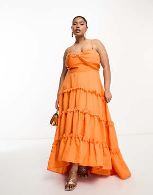 ASOS DESIGN Curve - Gestuftes Babydoll-Maxikleid aus Voile in Orange mit Rüschen, Knotendesign vorne und nach hinten abf...