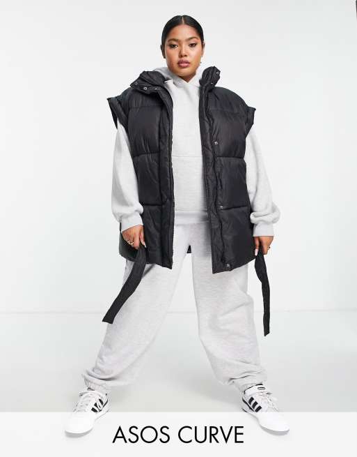 ASOS DESIGN Curve - Gewatteerd puffer giletjack met ceintuur in zwart