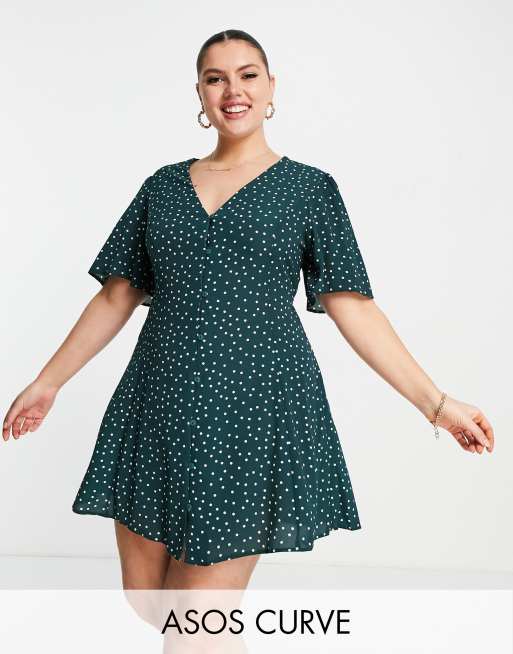 ASOS DESIGN Curve - Grøn prikket mini-tea-kjole med knapper og bindebånd bagpå samt engleærmer