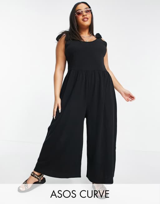 ASOS DESIGN Curve – Hänger-Jumpsuit in Schwarz mit Trägern zum Binden