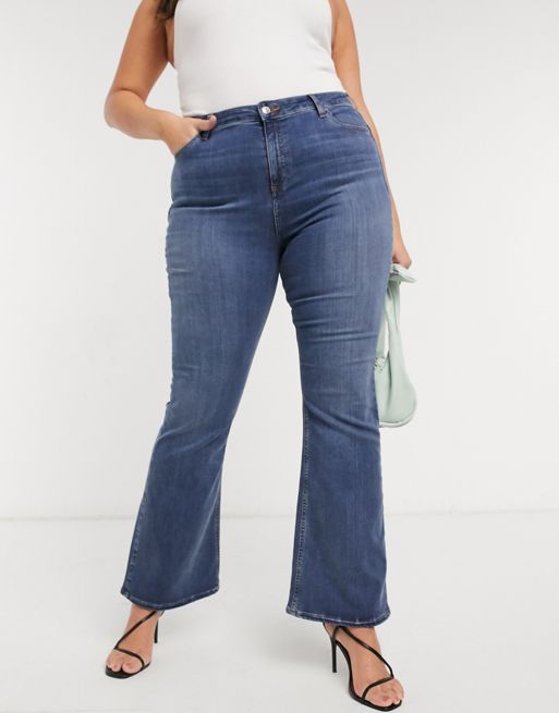 ASOS DESIGN Tall high rise 'lift and contour' stretch flare jeans in mid  blue