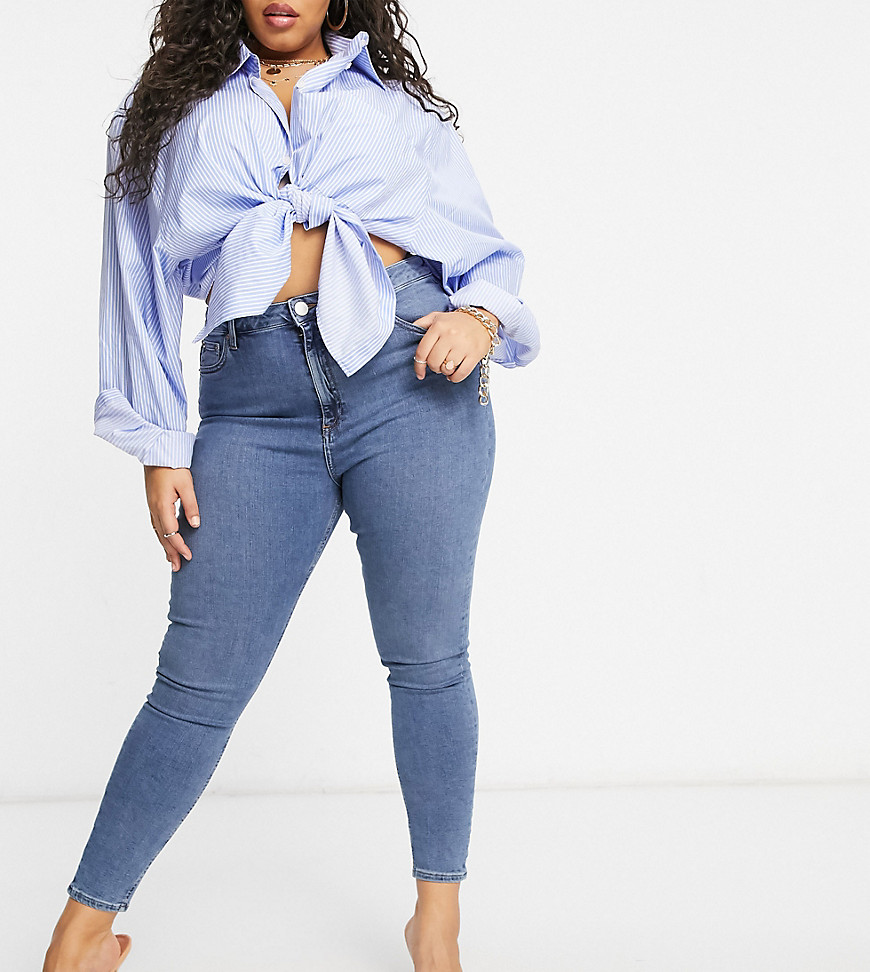 Plus-size jeans by ASOS DESIGN Part of our responsible edit High rise Belt loops Zip fly Five pockets Skinny fit Tight cut, regular on the waist