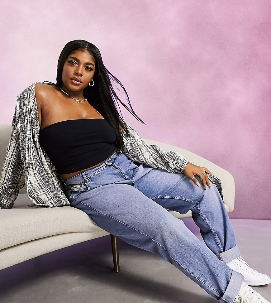 Plus-size jeans by ASOS DESIGN Part of our responsible edit Super high rise Belt loops Zip fly Five pockets Double turn-up cuffs Sits on the ankle Oversized, tapered fit Cut loosely around the thigh with a tapered leg